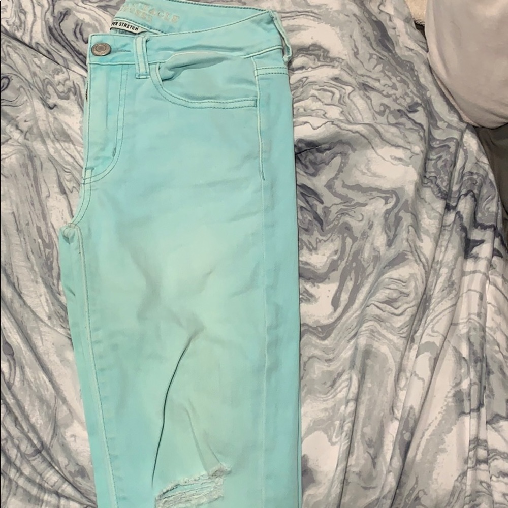 American eagle teal jeans (with rips) size 2